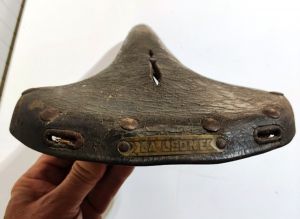Vintage leather saddle from 1920 for bicycle.